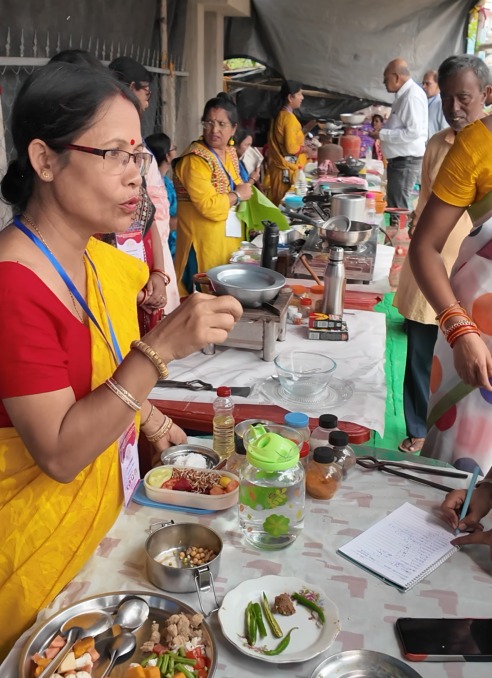 Women cooking with local ingredients at World Food Day