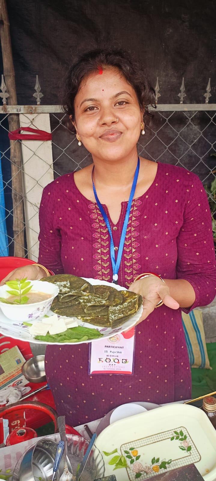 Participant presenting her nutritious dish