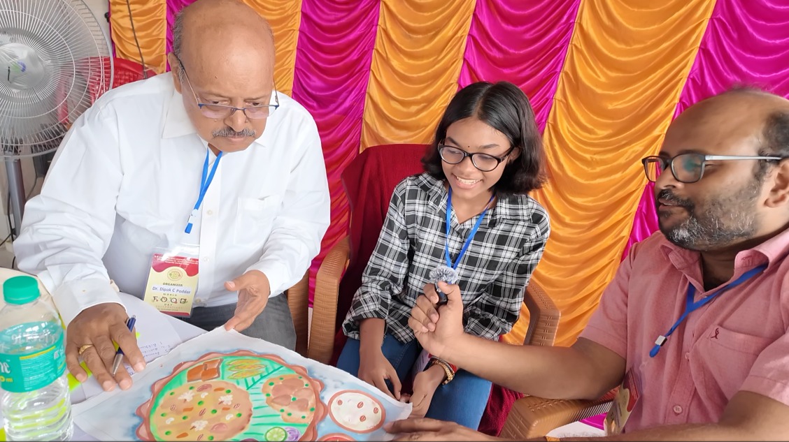 Judges evaluating children's nutrition drawings